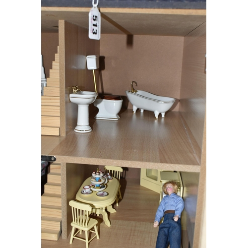 513 - A MODERN THREE STOREY DOLLS HOUSE OF LATE VICTORIAN STYLE, with papered red brick effect exterior, h... 