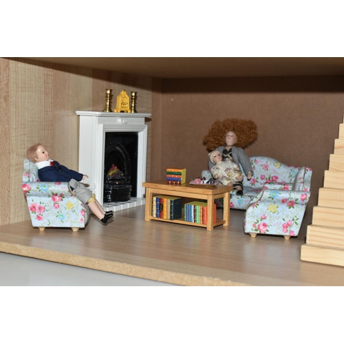 513 - A MODERN THREE STOREY DOLLS HOUSE OF LATE VICTORIAN STYLE, with papered red brick effect exterior, h... 