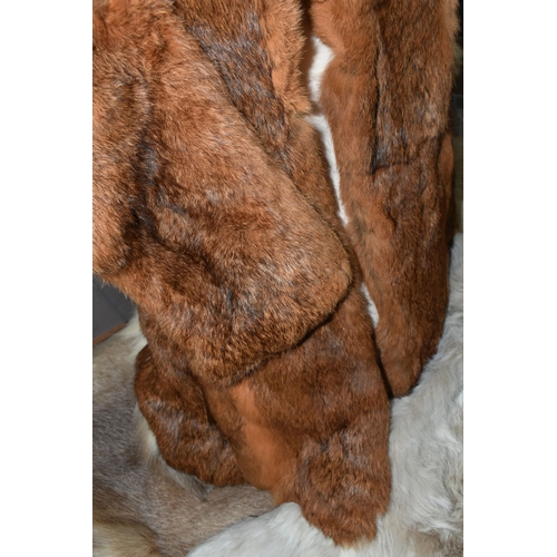 515 - FIVE REINDEER HIDES AND TWO FUR JACKETS, the reindeer hides of similar size, length of longest 145cm... 