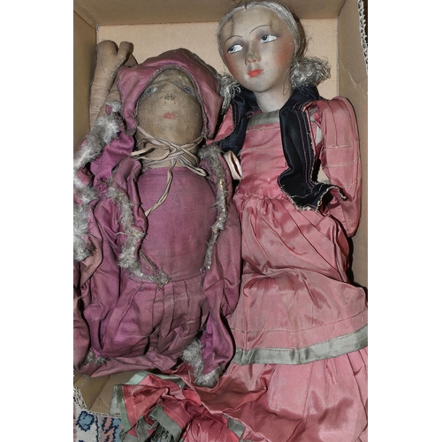 517 - A VINTAGE CLOTH HEAD DOLL, moulded and painted features, original wig, cloth body with composition l... 