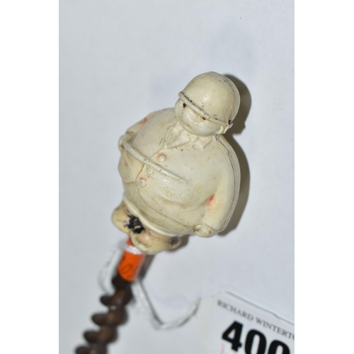 400 - A 1920S NOVELTY CORKSCREW, the celluloid handle in the form of a 'Jolly Huntsman', height of figure ... 