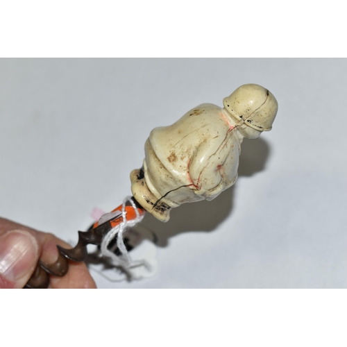 400 - A 1920S NOVELTY CORKSCREW, the celluloid handle in the form of a 'Jolly Huntsman', height of figure ... 