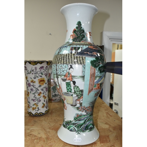 438 - A 19TH CENTURY CHINESE FAMILLE VERT BALUSTER VASE, enamelled with a continuous scene of figures in b... 