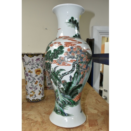 438 - A 19TH CENTURY CHINESE FAMILLE VERT BALUSTER VASE, enamelled with a continuous scene of figures in b... 