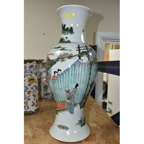 438 - A 19TH CENTURY CHINESE FAMILLE VERT BALUSTER VASE, enamelled with a continuous scene of figures in b... 