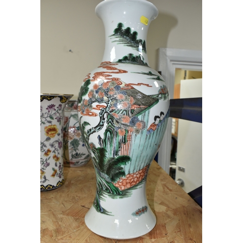 438 - A 19TH CENTURY CHINESE FAMILLE VERT BALUSTER VASE, enamelled with a continuous scene of figures in b... 