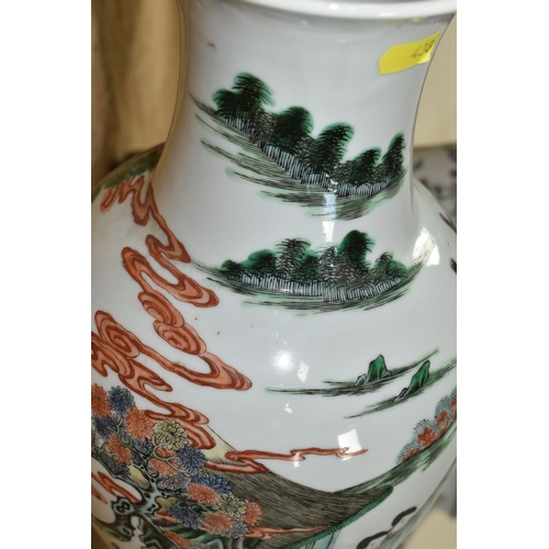 438 - A 19TH CENTURY CHINESE FAMILLE VERT BALUSTER VASE, enamelled with a continuous scene of figures in b... 