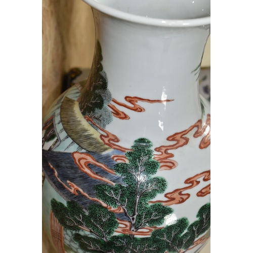 438 - A 19TH CENTURY CHINESE FAMILLE VERT BALUSTER VASE, enamelled with a continuous scene of figures in b... 