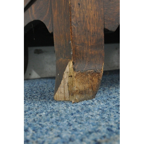 1213 - A 20TH CENTURY OAK CABINET, the single glazed door enclosing three adjustable shelves, above a singl... 