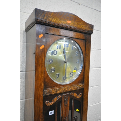 1297 - AN EARLY TO MID 20TH CENTURY OAK LONGCASE CLOCK, the full length door enclosing a 11 inch dial, heig... 