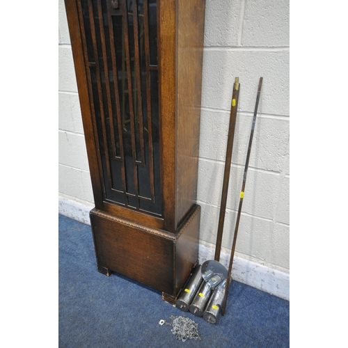 1297 - AN EARLY TO MID 20TH CENTURY OAK LONGCASE CLOCK, the full length door enclosing a 11 inch dial, heig... 