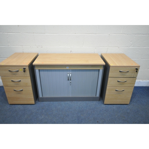 1300 - THREE MODERN OFFICE FURNITURE PIECES, to include a tambour front cabinet, and two three drawer filin... 