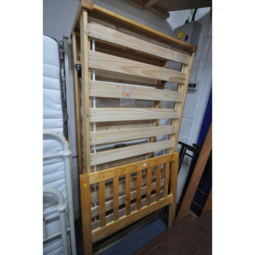 1304 - A MODERN PINE SINGLE BEDSTEAD, with pull out guest bed (condition report: with bolts)