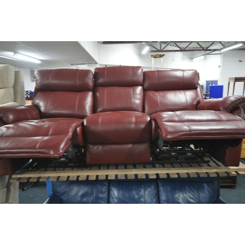 1306 - A RED LEATHER ELECTRIC THREE SEATER SOFA, with multiple buttons to recline, adjustable headrest, cen... 