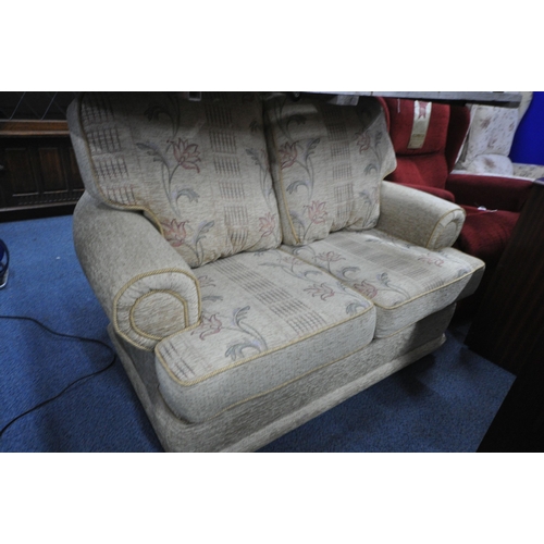 1308 - A FLORAL UPHOLSTERED THREE PIECE LOUNGE SUITE, comprising a three seater armchair, and a pair of arm... 