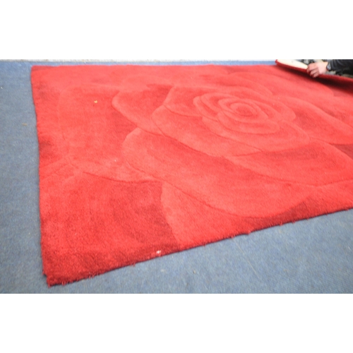 1309 - A UPHOLSTERED RUG OF A ROSE, 229cm x 162cm (condition report: in need of cleaning)