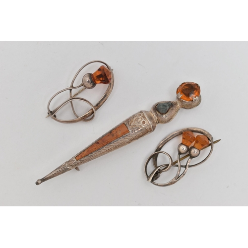 14 - THREE BROOCHES, two white metal open work brooches of thistles set with faceted orange paste, both f... 