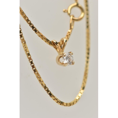 35 - A DIAMOND SINGLE STONE PENDANT WITH YELLOW METAL CHAIN, the pendant set with a round brilliant cut d... 