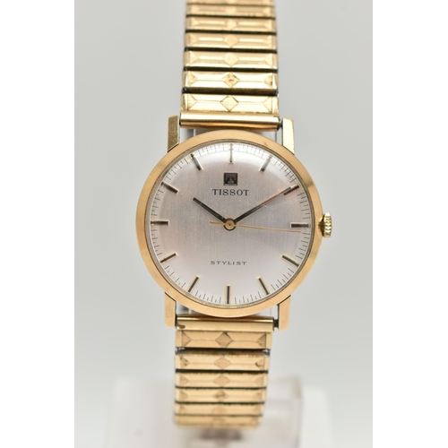 37 - A GENTS 9CT GOLD 'TISSOT' WRISTWATCH, manual wind, round silver dial signed 'Tissot Stylist', baton ... 