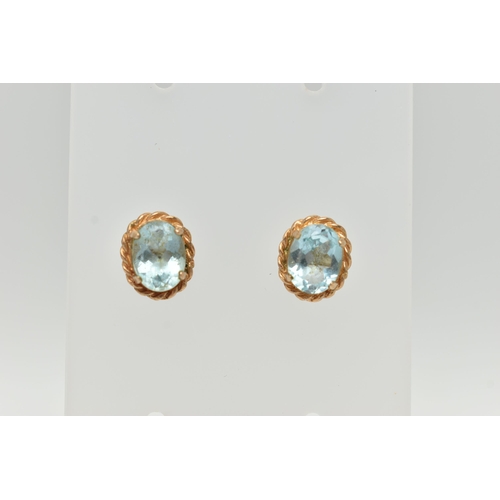 55 - TWO PAIRS OF EARRINGS, to include a pair of oval topaz stud earrings with rope twist surround, and a... 