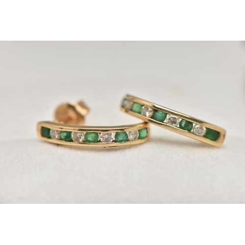 56 - A PAIR OF EMERALD AND DIAMOND EARRINGS, each designed as half hoops channel set with four brilliant ... 