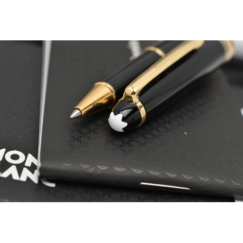 72 - A CASED MONT BLANC MEISTERSTUCK PIX ROLLERBALL PEN, the black pen case with gold coloured trim, stam... 