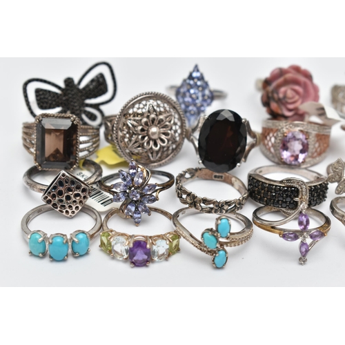 73 - A SELECTION OF WHITE METAL RINGS, various designs, some set with semi-precious gemstones, marks to i... 
