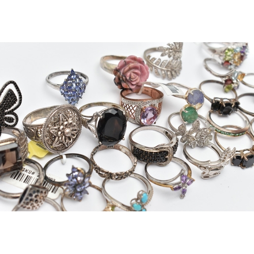 73 - A SELECTION OF WHITE METAL RINGS, various designs, some set with semi-precious gemstones, marks to i... 