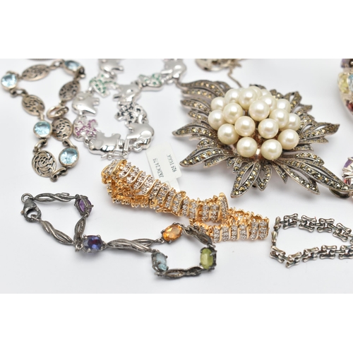 74 - ASSORTED WHITE METAL BRACELETS AND A BROOCH, to include a large multi gem set cuff bangle, set with ... 