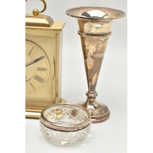 124 - A SILVER POSY VASE, SALT AND THREE CARRIAGE CLOCKS, tapered polished posy vase on a round weighted b... 