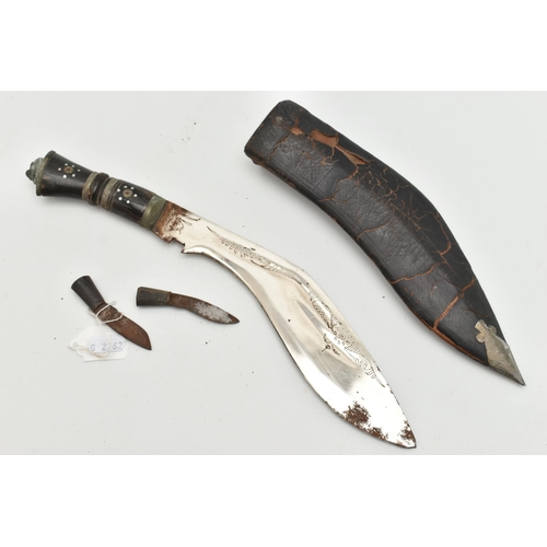 86 - A KUKRI KNIFE, with a horn handle in a leather sheaf with two additional inset knives, approximate l... 