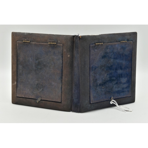 97 - A DOUBLE PHOTO FRAME, white metal lined frame, with  embossed foliate pattern with cherubs, folding ... 