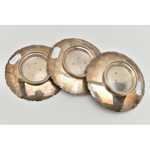 98 - A SELECTION OF THREE SILVER DISHES, each dish with geometric design border, approximate diameter of ... 