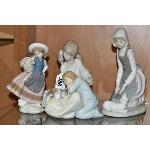 388 - A GROUP OF THREE LLADRO AND NAO FIGURES, comprising 1534 'Little Sister',  5221 'Sweetest Scent' des... 