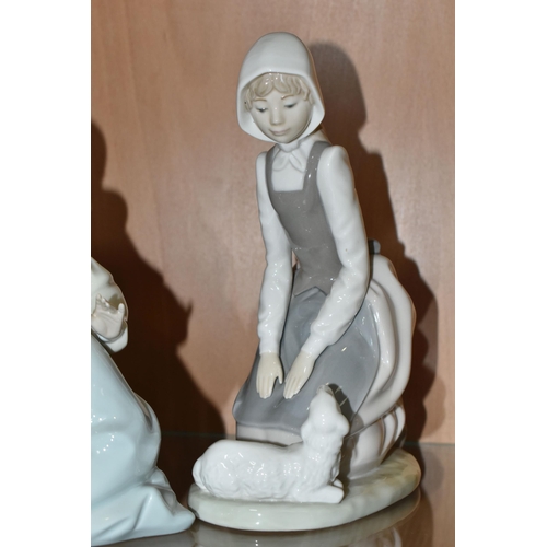 388 - A GROUP OF THREE LLADRO AND NAO FIGURES, comprising 1534 'Little Sister',  5221 'Sweetest Scent' des... 