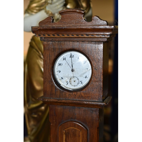 420 - A GROUP OF CLOCKS AND FIGURAL LAMP BASES, comprising a pocket watch and stand, the continental pocke... 