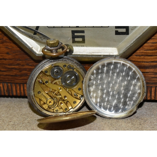 420 - A GROUP OF CLOCKS AND FIGURAL LAMP BASES, comprising a pocket watch and stand, the continental pocke... 