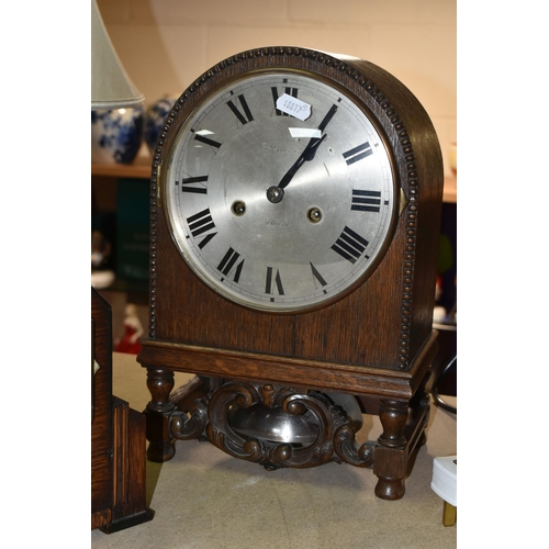 420 - A GROUP OF CLOCKS AND FIGURAL LAMP BASES, comprising a pocket watch and stand, the continental pocke... 