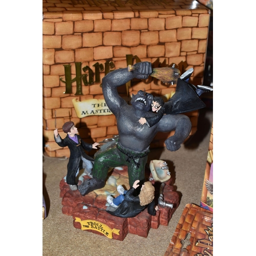 423 - A GROUP OF HARRY POTTER RELATED ITEMS, to include four boxed Enesco 'water balls': Harry Potter, Her... 