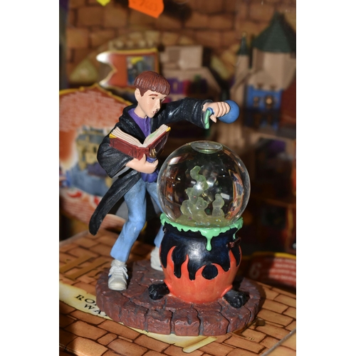 423 - A GROUP OF HARRY POTTER RELATED ITEMS, to include four boxed Enesco 'water balls': Harry Potter, Her... 