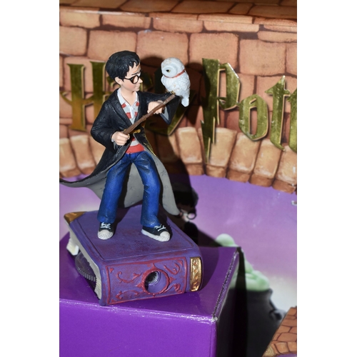 425 - A GROUP OF BOXED ENESCO HARRY POTTER ITEMS, comprising a Harry Potter cookie jar (glasses loose), Ha... 