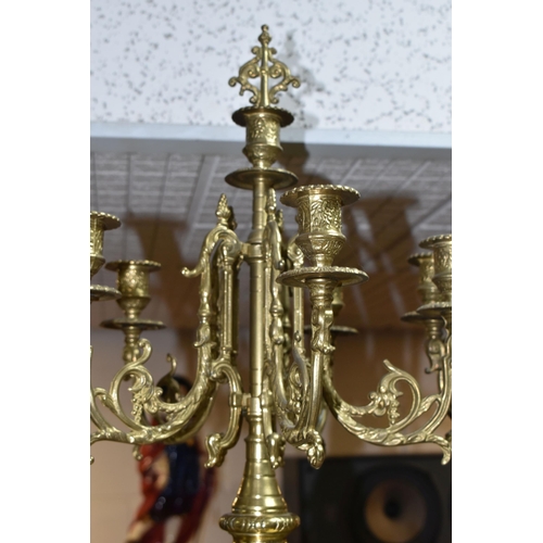 433 - A BRASS FRANZ HERMLE CLOCK GARNITURE, the clock having a chapter ring inset with enamel Roman Numera... 