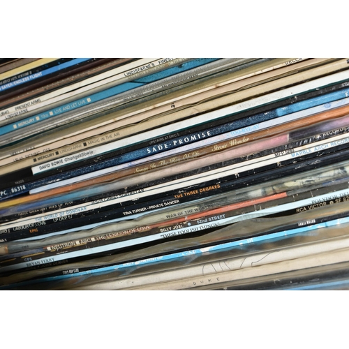 534 - TWO BOXES OF RECORDS, over one hundred LPs and 12'' singles by artists to include Queen, David Bowie... 