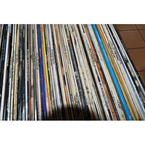 534 - TWO BOXES OF RECORDS, over one hundred LPs and 12'' singles by artists to include Queen, David Bowie... 