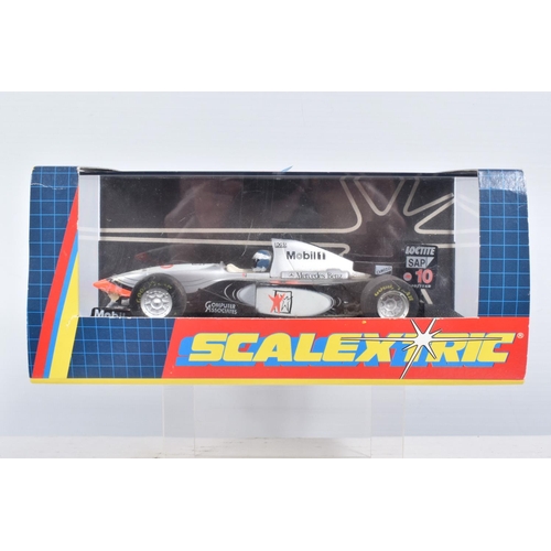 24 - A QUANTITY OF BOXED AND UNBOXED SCALEXTRIC CARS AND MOTORBIKES, boxed McLaren Mercedes MP4/10, RN10 ... 