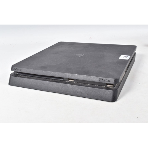 178 - A PLAYSTATION 4 SLIM CONSOLE AND CONTROLLER, console is notably dirty, but is in working condition a... 