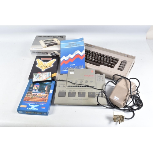 179 - A COMMODORE 64 COMPUTER, TAPE PLAYERS AND A SMALL QUANTITY OF GAMES, games include Club Record Contr... 