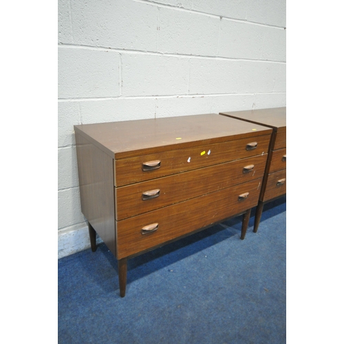 1203 - A PAIR OF WRIGHTON MID CENTURY TEAK CHEST OF THREE LONG DRAWERS, on cylindrical tapered legs, length... 