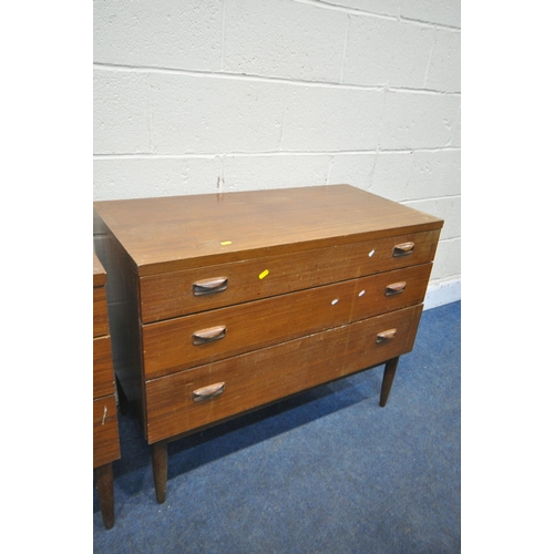 1203 - A PAIR OF WRIGHTON MID CENTURY TEAK CHEST OF THREE LONG DRAWERS, on cylindrical tapered legs, length... 