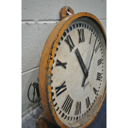 1205 - A GENTS OF LEICESTER CAST IRON WALL CLOCK, mains electric movement, orange painted border with three... 